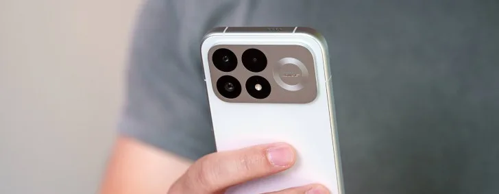 Poco F9 Pro smartphone showing its rear camera module and glass back